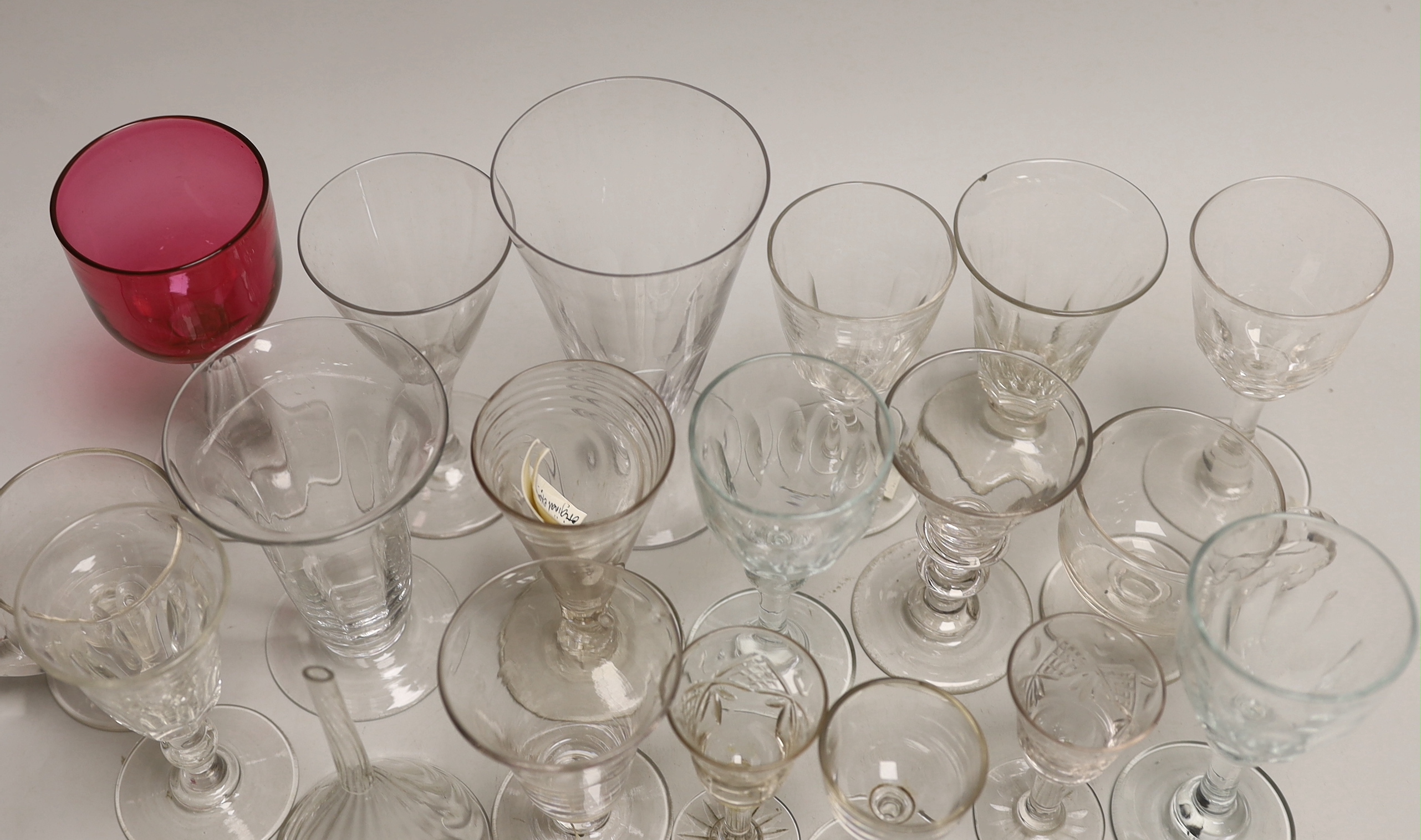 A quantity of antique and later glasses including a Georgian dwarf ale glass and Victorian cranberry example the largest 14cm high